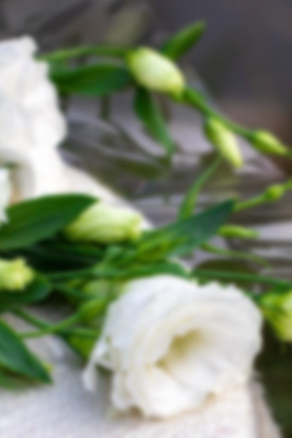 Sad, funeral and flowers with couple and coffin in church for death, respect and mourning. Grief, goodbye and empathy with man and woman loss at casket with depression, remember and farewell memorial.